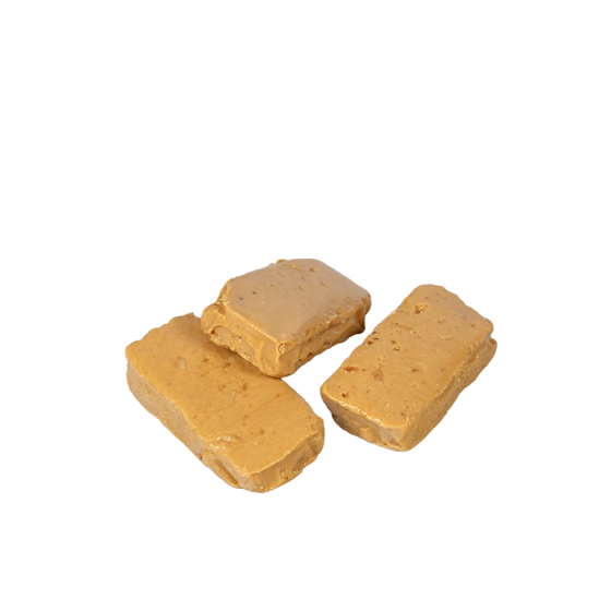 Porciones de turrón blando de almendra, textura suave y jugosa. Calidad suprema para disfrutar en Navidad.